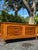 Elegant vintage Thomasville dresser featuring a beautifully crafted campaign-inspired design with clean architectural...
