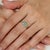 The Hallmarked 925 Silver Pear-Cut Natural Emerald Toi et Moi Ring features a graceful two-stone design showcasing a 0.86...