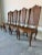 This elegant set of four vintage French Country Louis XV–style dining chairs showcases timeless craftsmanship and romantic...