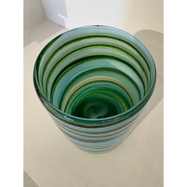 These cocktail glasses are categorised by two shaded streamers which curl up to create anfixed stripe in alternating...