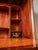 Secretary with a hinged top and a marble top in the classicist style. The top marble top made of green French marble is...