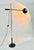 Floor lamp model "1004" designed by Gino Sarfatti for Arteluce, 1961. Perforated reflector in lacquered aluminum, with the...