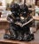 Full of charm and expressive detail, this antique French bronze sculpture depicts two young children seated closely...