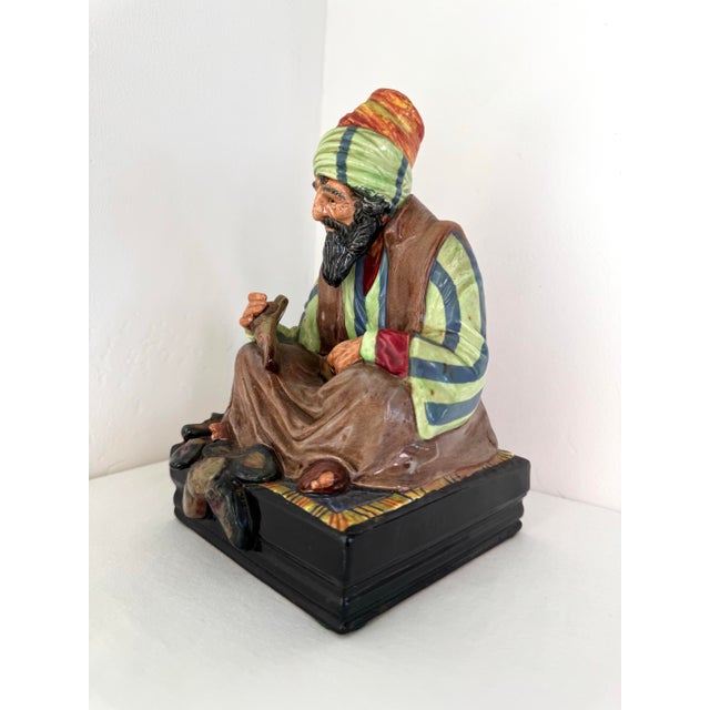 For sale is the Royal Doulton "The Cobbler" Figurine (HN 1706), a beautiful and intricately crafted piece. This...