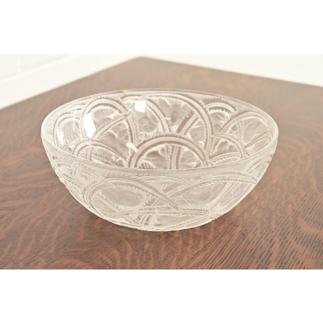 A gorgeous Art Deco or Art Nouveau bowl featuring small finches nestled among arched, serrated leaves and fern fronds in a...