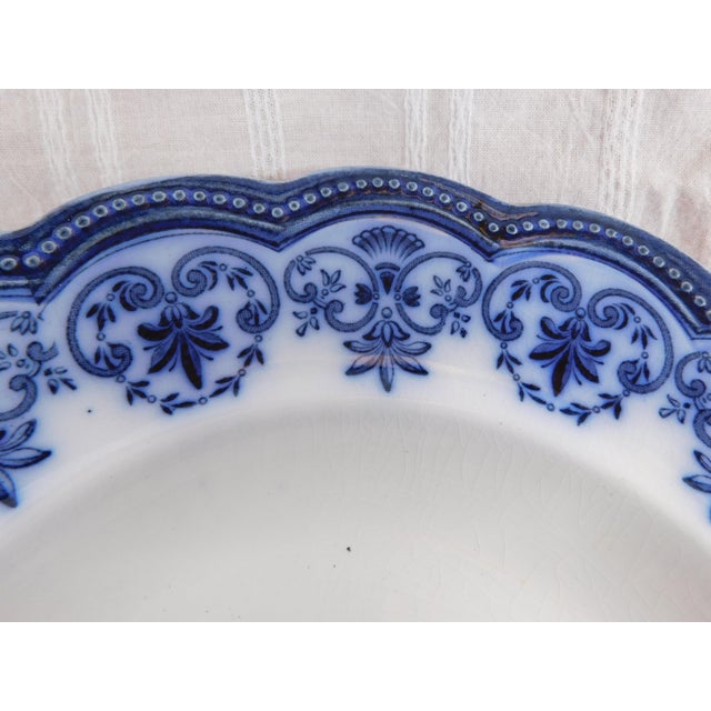 This is a Johnson Brothers Flow Blue Rimmed Serving bowl in the Regent pattern. I do not have a date for the pattern, but...