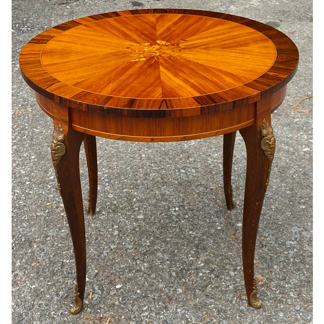 Louis XV Style Gilt Floral Marquetry Tulipwood and Kingswood Gueridon Table Measures 20.25" in width , 20.25" on depth,...