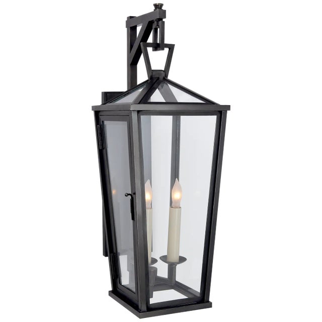 Darlana Small Tall Bracketed Wall Lantern in Bronze Designer: Chapman & Myers Height: 21.25" Extension: 9.75" Backplate:...