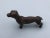 Very sturdy iron dachshund statue in majestic stance. Great tabletop decoration. Could be dependable paperweight. 3.75”...