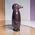 Add a touch of whimsical modern design to your space with this striking glazed ceramic penguin sculpture. Standing 13...