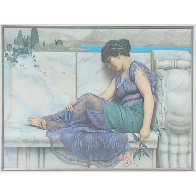 A beautifully presented vintage print after John William Godward, featuring his serene and contemplative composition...