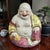 This vintage Famille Rose hand-painted laughing Buddha figurine is a unique and charming piece that showcases intricate...