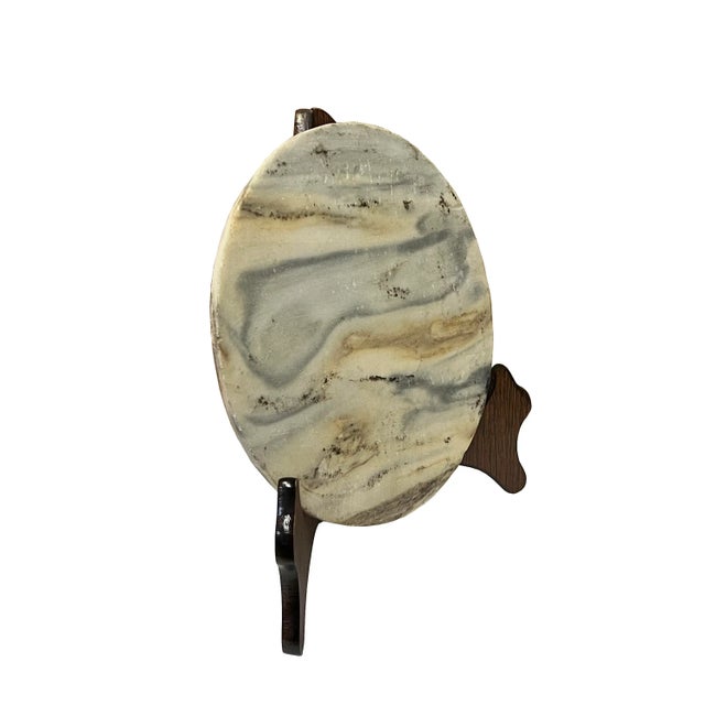 This is a round shape natural stone display with a natural abstract pattern. It is a nice unique accent piece for home...