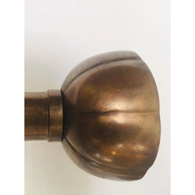 Fabulous pair of large brass candlesticks on a round scalloped base. Tall form with scalloped base and upper part...