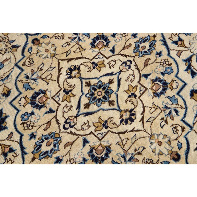 Beautiful Persian Kashan hand-knotted wool rug with a beige field. This piece has a multicolor accents in an all-over...