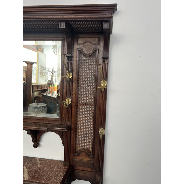 Louis xvi style oak console coat rack hat rack with cane backing on the upper section eight bronze panthers and two cane-...