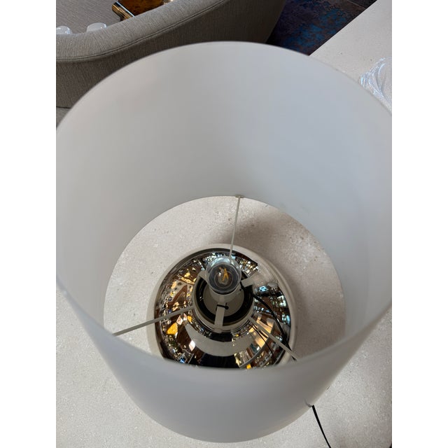 Elegant "Cindy" table lamp attributed to Ferrucio Laviani, produced circa 1970s. The design features a polished chrome...