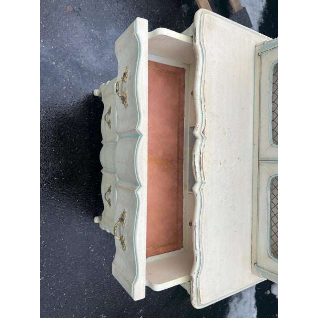 This French Provincial style vintage secretary desk cabinet, circa 1950s, showcases graceful serpentine lines, cabriole...