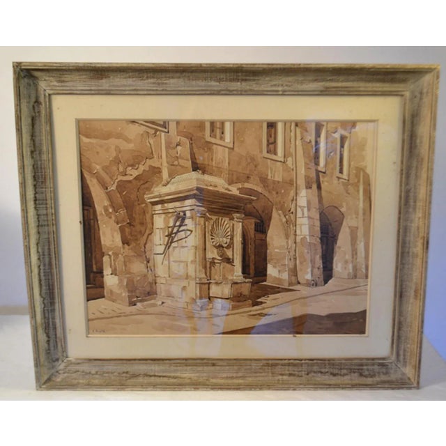 Framed watercolor drawing of a fountain in a Annecy town in France.