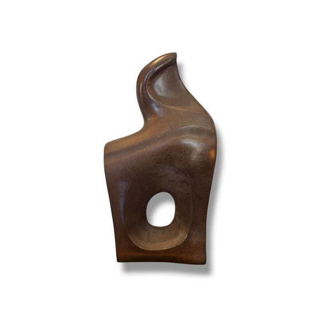 Striking original bronze sculpture by artist Sharon Lee Andreasen, featuring an abstract, organic form that feels both...