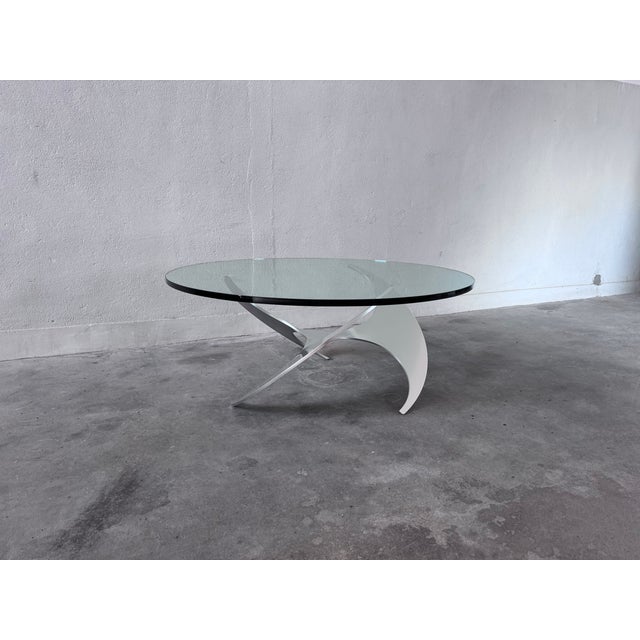 1970s Knut Hesterberg coffee table with solid glass top and brushed aluminum frame Diameter (tabletop) 110 cm Height 47 cm...