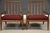 A pair of mid century modern solid walnut lounge chairs with wine maroon red tweed new upholstery designed by T.H....