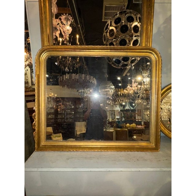 This 19th c. French Louis Philippe Giltwood Mirror is a rare find with its wide scale design. The mirror features a...