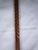 Barley Twist Walnut Walking Stick with tiered brass handle. Measures 37"L x 2"D and is in excellent condition;