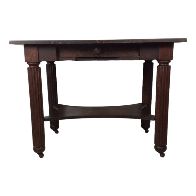 Antique Oak Writing Table With Drawer and Turned Wood Legs on Wheels For Sale