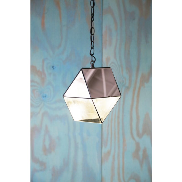 Custom made hexagonal mirrored glass and smoked lucite pendant lamp with 15’ of chain. Smoked lucite bottom allows light...