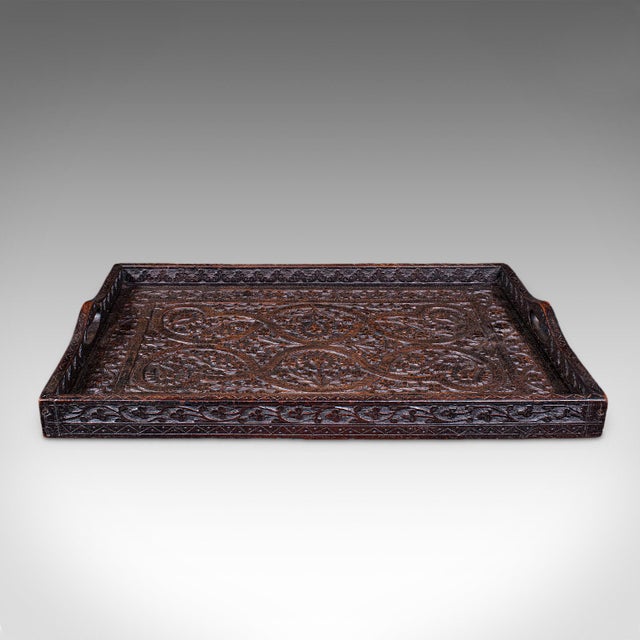 This is an antique carved serving tray. An Anglo-Indian, mahogany afternoon tea or cocktail platter, with delightful...