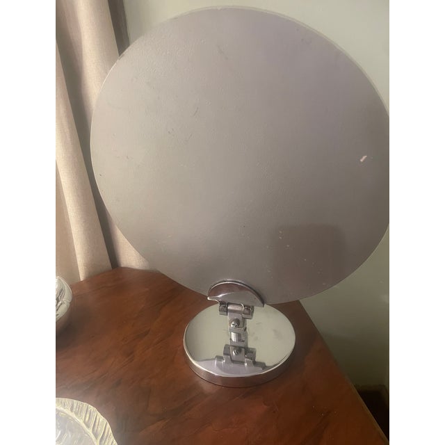 This is a 1960s chrome base round 15 inch vanity mirror or table mirror, Charles Hollis Jones is the designer and maker....