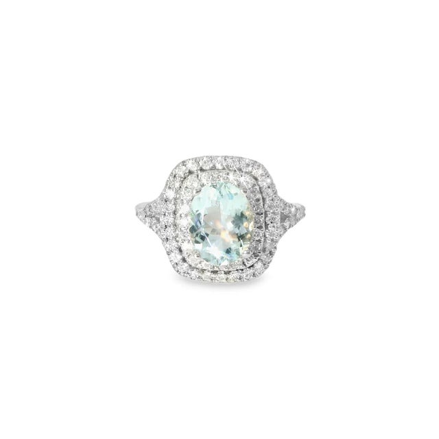 Add elegance with this stunning 14K white gold band ring featuring a natural oval aquamarine accented by brilliant round...