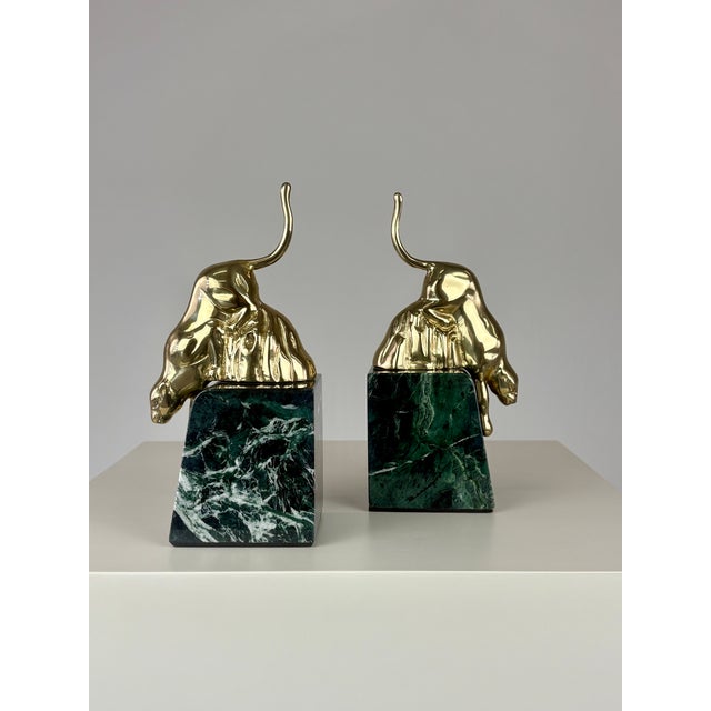A striking blend of dramatic glamour and classic sophistication, this vintage pair of Hollywood Regency bookends features...