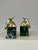A striking blend of dramatic glamour and classic sophistication, this vintage pair of Hollywood Regency bookends features...
