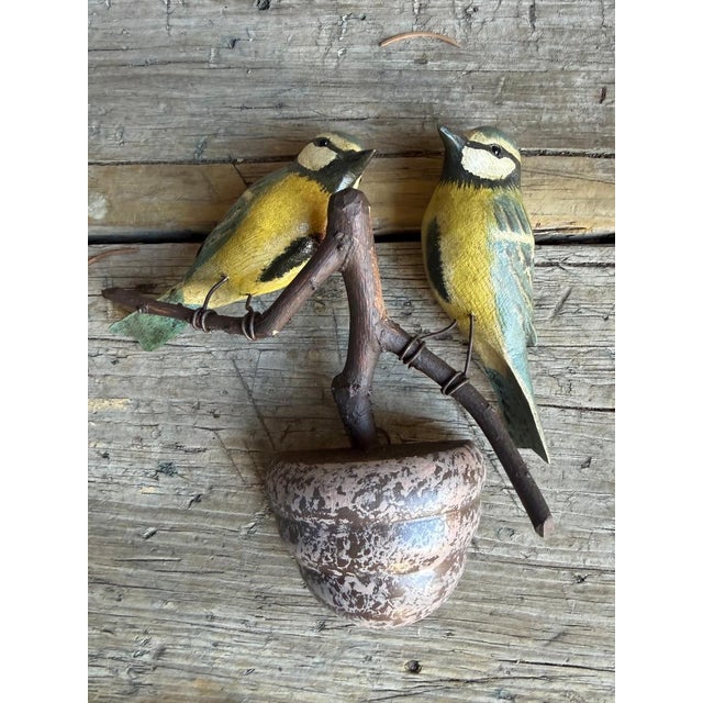 A pair of folk art birds from Austria — hand carved wood. Measures 6" x 5.5" x 1.75". A charming folk-art pair for a...