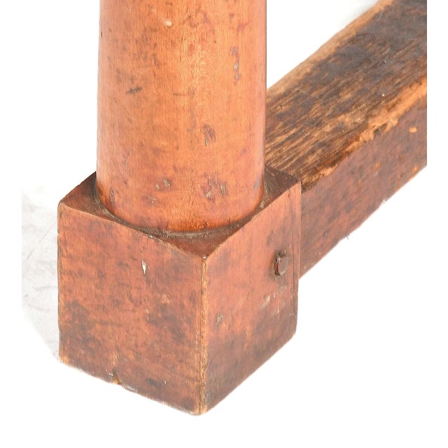 An attractive and refined 18th century American farm table, crafted with a pine top over a maple base, exemplifying the...