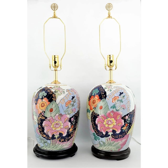 Offering a remarkable RARE pair of completely restored vintage hand painted Chinese Tobacco Leaf lamps, circa Mid to early...
