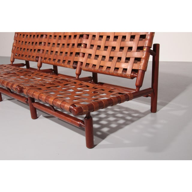 This rare three-seater sofa by Finnish deisgner Ilmari Tapiovaara for Paolo Arnaboldi was a commission of the Italian...