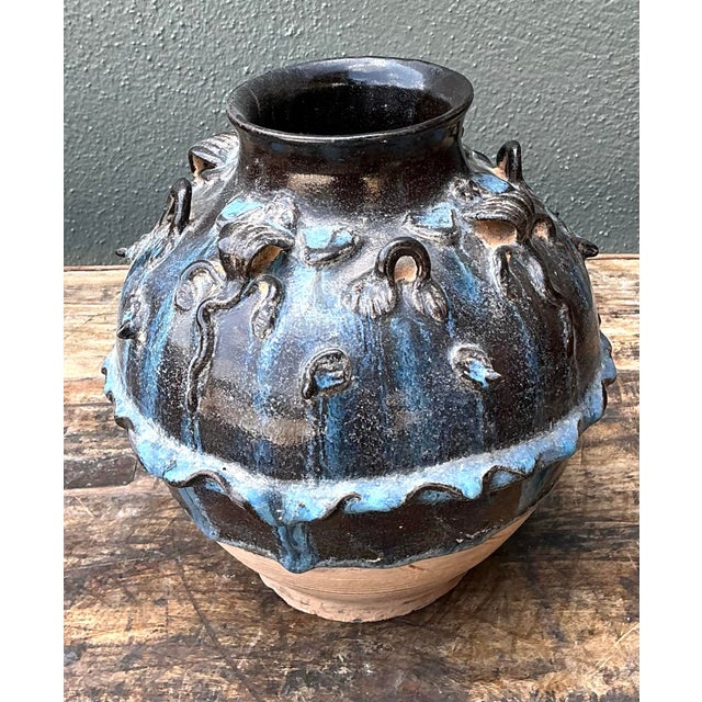 This avant-garde studio pottery urn is a striking fusion of Brutalist form and masterful glaze application. The globular...