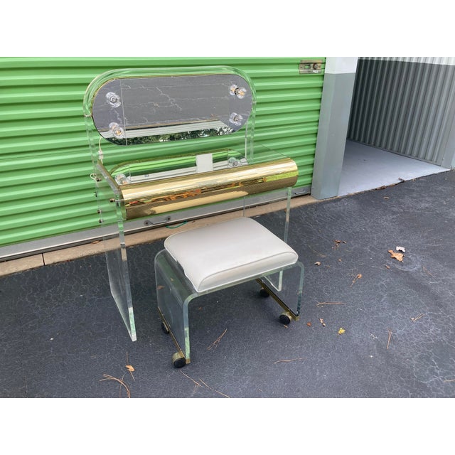 A fabulous mid-20th century lucite and brass mirrored and lighted vanity table and stool by Hill Furniture (Hill by...