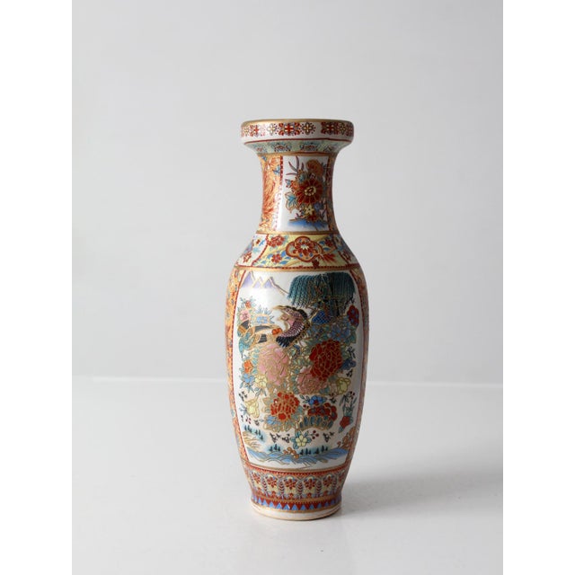 Vintage Chinese porcelain vase featuring colorful Famille Rose style decoration with birds, peonies, flowering branches,...