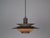 The lamp's form was designed based on the principle of a reflective system that directs light not only downward but also...