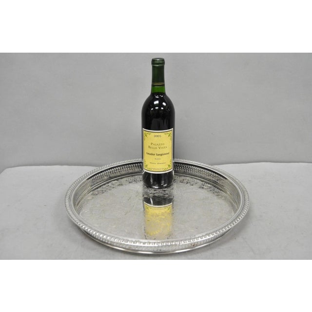 Vintage WM Rogers 672 Round Silver Plated Raised Gallery Serving Platter Bar Tray. Circa Mid 20th Century. Measurements:...