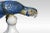 Royal dux ceramic statue of a blue macaw, perched on a stand in typical inquisitive stance. Having a pink triangle to...