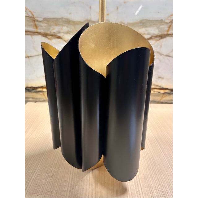 From Hudson Valley, the Banks pendant light has six lamps, striking gold and black colors, and modern appeal. A bold...