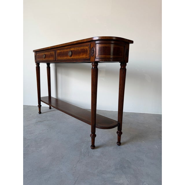 An elegant Jonathan Charles console table from the distinguished Buckingham Collection, crafted in a refined Classic...
