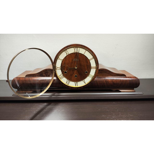 Elegant and historically rich, this Karl Lauffer Westminster-chime mantel clock dates from circa 1930s–1940s. Crafted in...