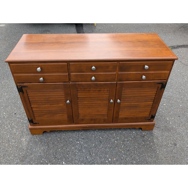 Bring iconic mid-century craftsmanship and warm Colonial Revival charm into your home with this vintage Ethan Allen...