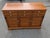 Bring iconic mid-century craftsmanship and warm Colonial Revival charm into your home with this vintage Ethan Allen...